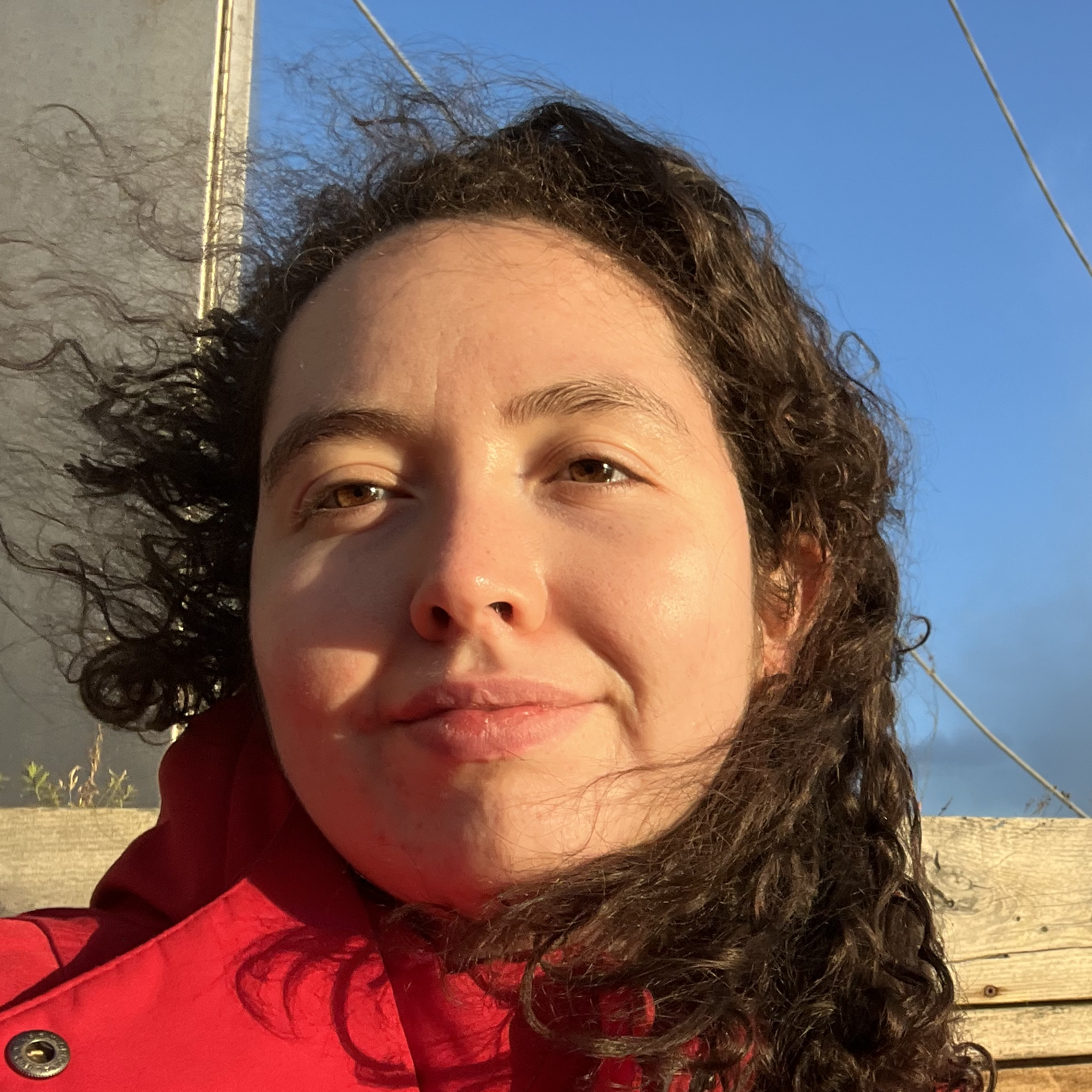 Shira is a white woman with brown hair