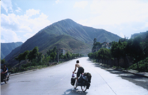 Biking uphill towards the mountains of Yunnan (Y)