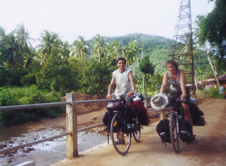 On the way to Ko Chang pier, in each other's shoes (we switched bikes for a while) :)